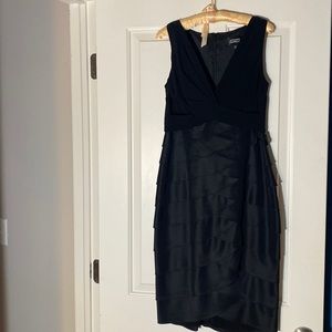 This black party dress is very unique but with simplicity. never been worn